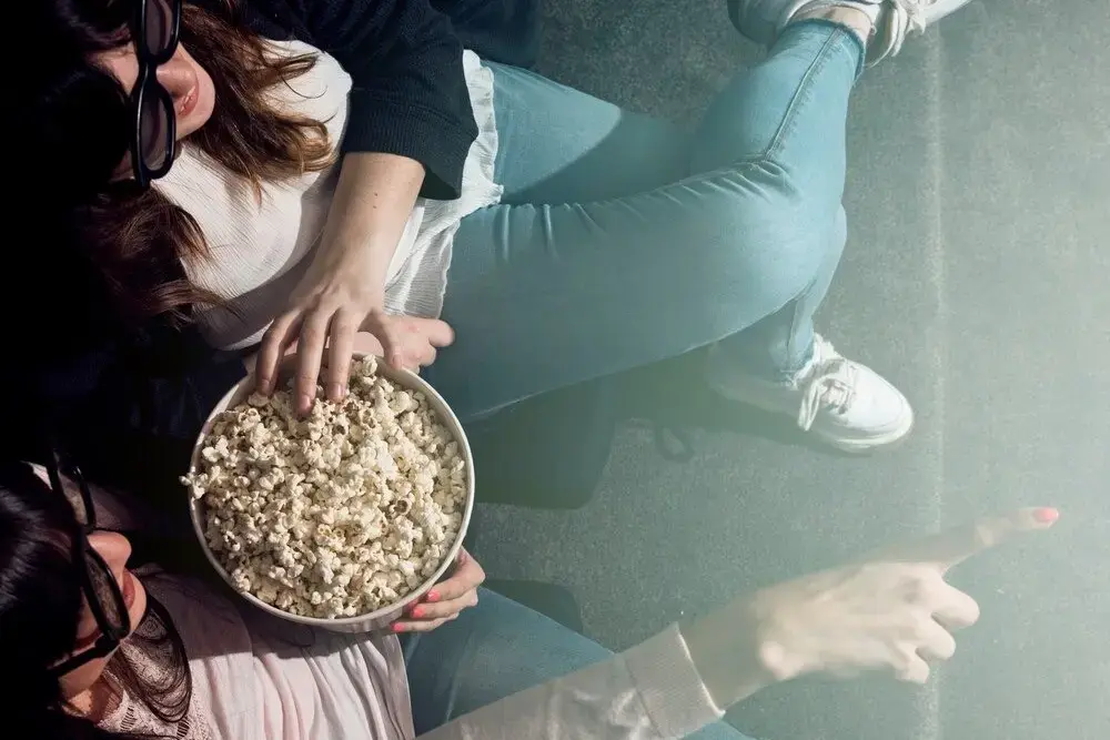 Girl with popcorn cinema