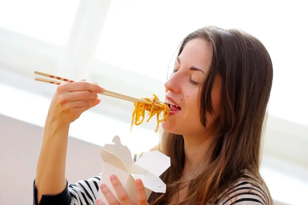 Woman Eating Noodle