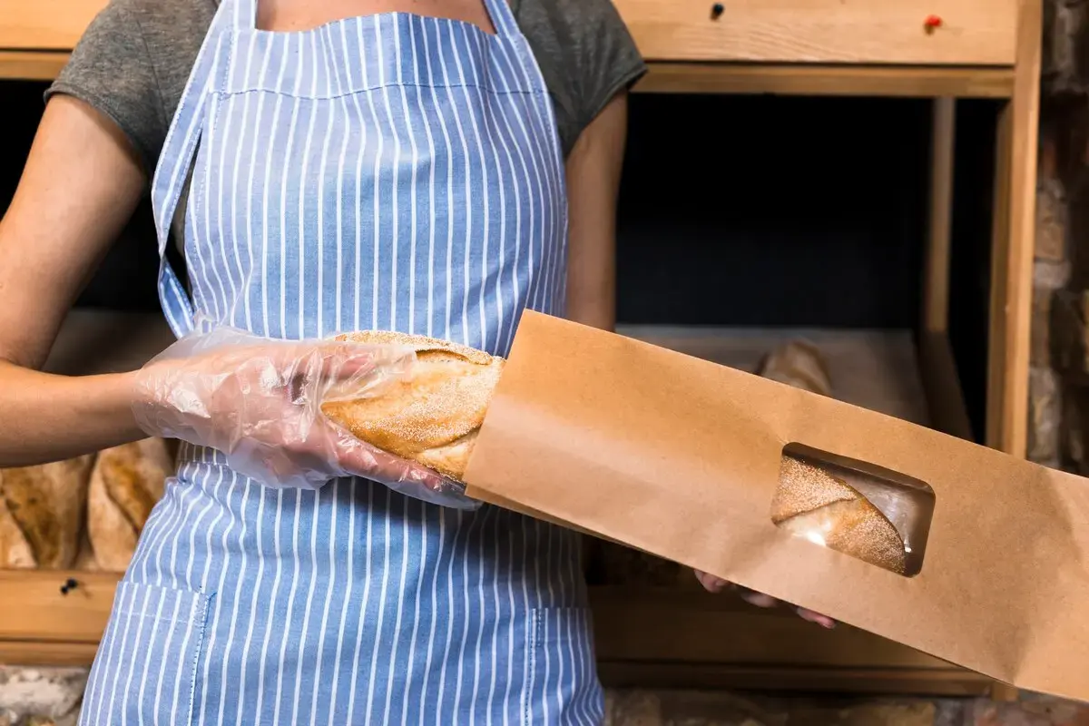 Woman Packaging Bread